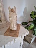 Stenen paarden kop., Ophalen