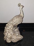 Gouden pauw beeld, Ophalen, Zo goed als nieuw