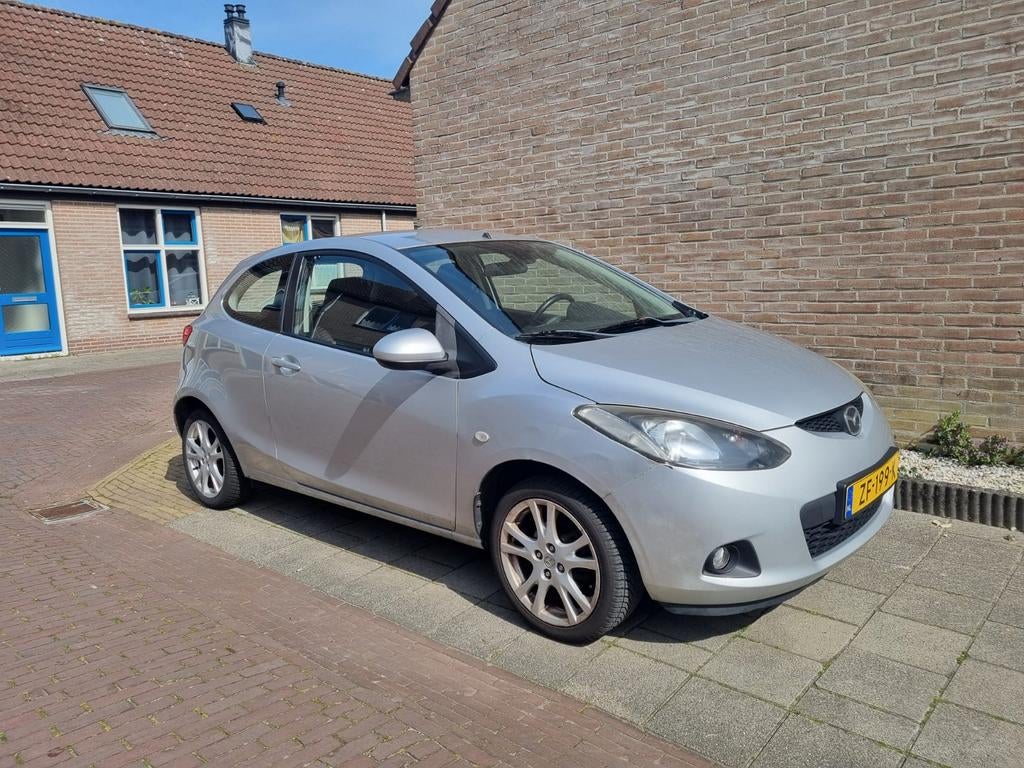Mazda 2 1.3 55KW 3DRS 2008 Grijs, Voorwielaandrijving, Stof, 74 pk, 4 cilinders