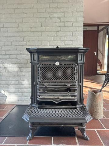 Authentieke Godin Lemaire houtkachel gietijzer beschikbaar voor biedingen