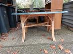 Tuintafel met rieten onderstel en een groen blad., Tuin en Terras, Tuintafels, Ophalen of Verzenden, Gebruikt, Rechthoekig