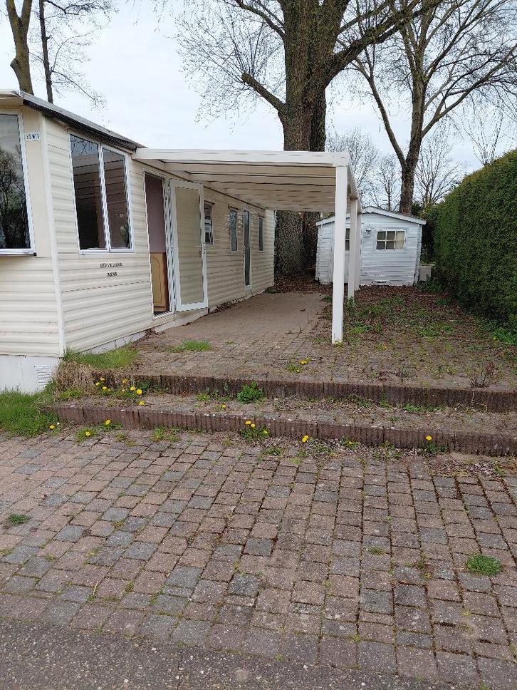 Sta caravan 10x4 met luifel, Caravans en Kamperen, Caravans, Particulier, tot en met 4, 2000 kg en meer, Rondzit, 2 aparte bedden