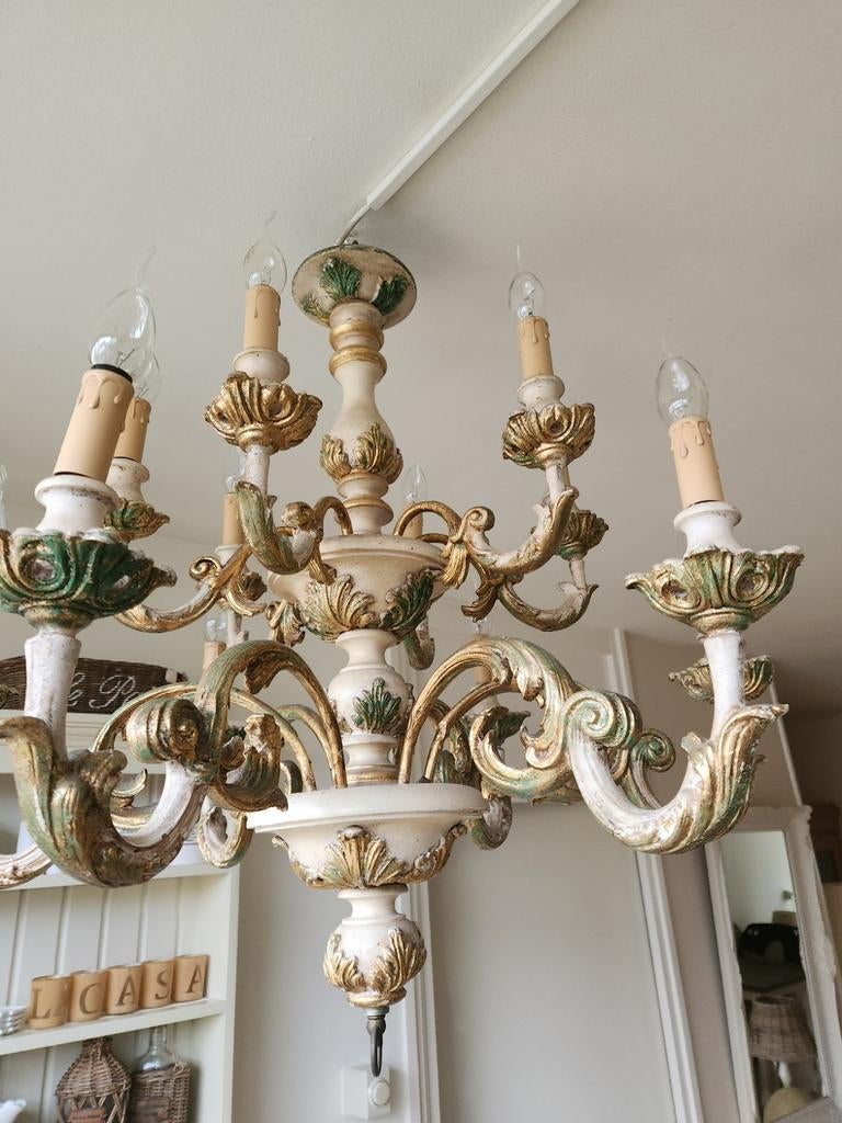 Antieke houten kroonluchter, Ophalen