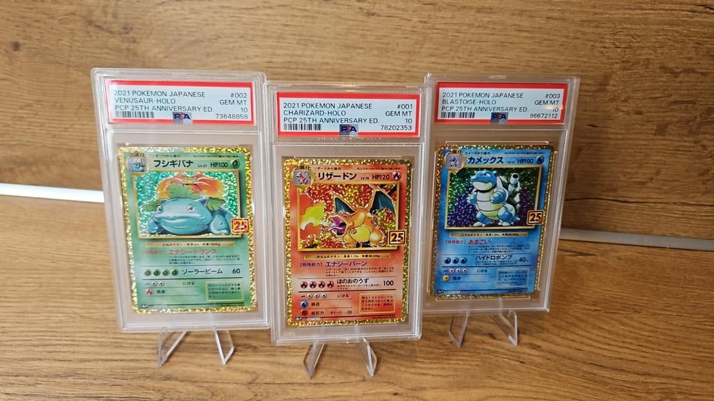 Pokémon Kaarten Charizard Blastoise Venusaur 25th PSA 10 Set, Ophalen of Verzenden, Zo goed als nieuw, Meerdere kaarten