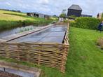 STORMSCHADE erfafscheiding natuurlijk wilgenschutting  42 m2