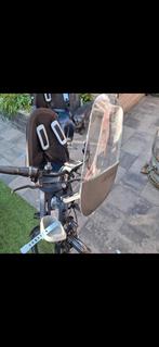 Qibbel fietsstoeltje en windscherm, Ophalen