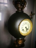 Groot beeld met bolpendule., Ophalen