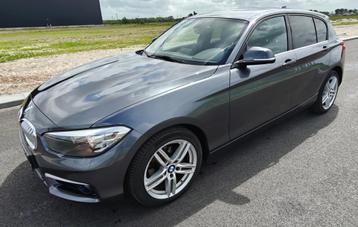 BMW 1-Serie 118i 136PK 5D Aut. 2015 Grijs beschikbaar voor biedingen