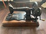 Antieke naaimachine Singer, Ophalen