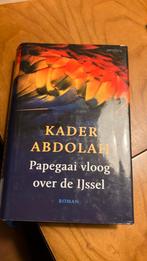 Kader Abdolah - Papegaai vloog over de IJssel, Ophalen of Verzenden, Zo goed als nieuw, Nederland, Kader Abdolah
