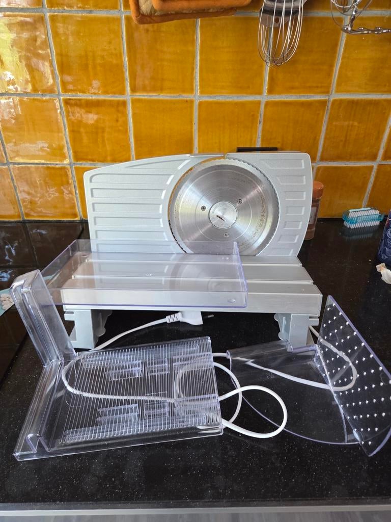 Snijmachine voor vleeswaren en brood, Ophalen