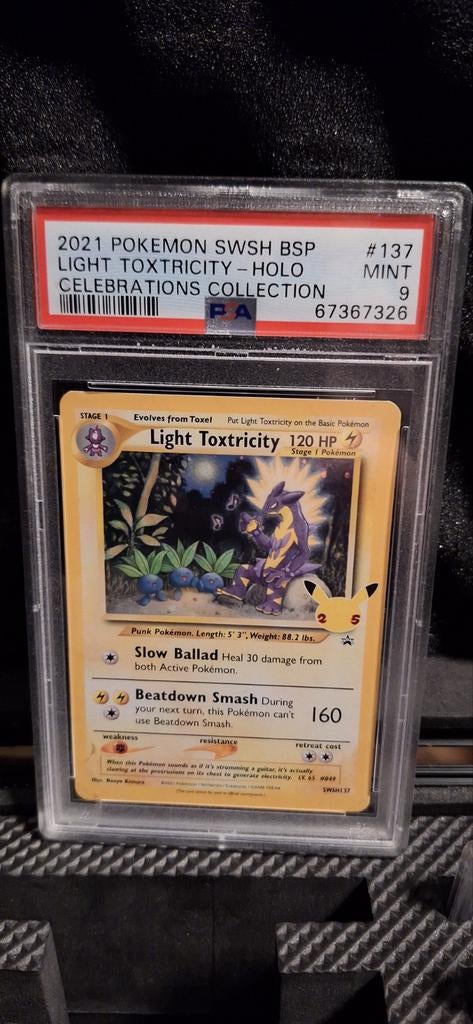 Pokémon Light Toxtricity Holo PSA 9 Mint Celebrations, Ophalen of Verzenden, Zo goed als nieuw, Losse kaart, Foil