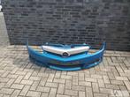 Opel Tigra 2004 -2010 voorbumper licht blauw klein scheurtje, Gebruikt, Voor, Opel, Ophalen of Verzenden