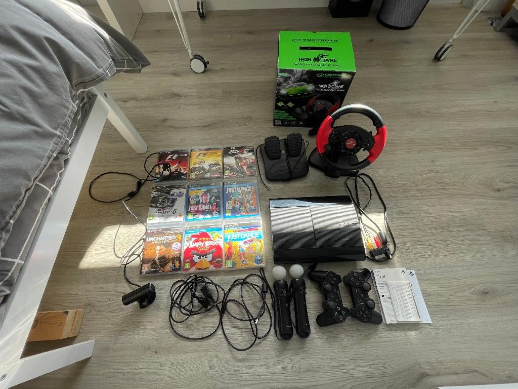 PS3 500GB, incl spellen en racestuur, Ophalen, Gebruikt