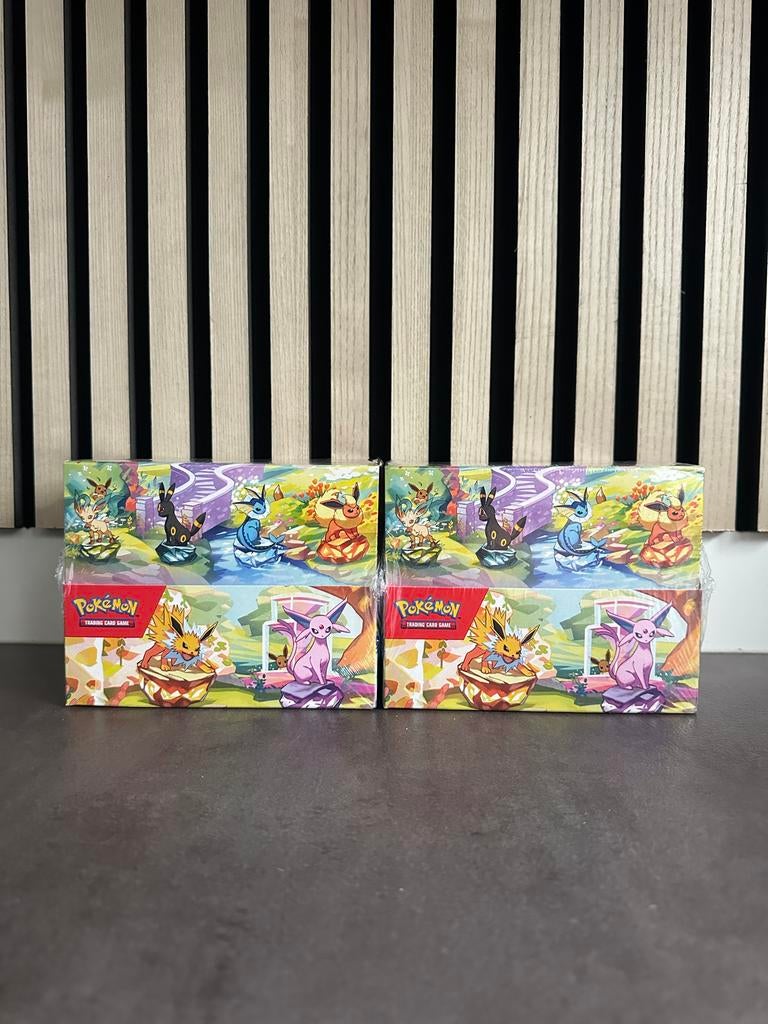 Pokémon Prismatic Evolutions Mini Tin Case (8 tins per case), Ophalen of Verzenden, Nieuw, Overige typen, Foil