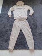 Als nieuw Tommy hilfiger joggingpak maat M, Kleding | Dames, Huispakken, Maat 38/40 (M), Beige, Ophalen of Verzenden, Zo goed als nieuw