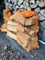 Droog Haardhout/Brandhout in handige grote netzakken, Tuin en Terras, Haardhout, Minder dan 3 m³, Ophalen, Eikenhout, Blokken