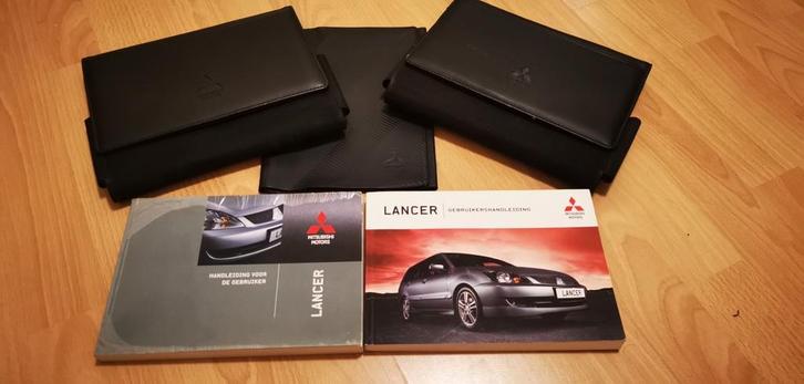2 x handleiding Mitsubishi Lancer + mapjes, Auto diversen, Handleidingen en Instructieboekjes, Ophalen of Verzenden