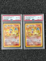 Pokémon 2x PSA 8 1st edition Charizard Dutch #4 Base set, Ophalen of Verzenden, Zo goed als nieuw, Meerdere kaarten, Foil