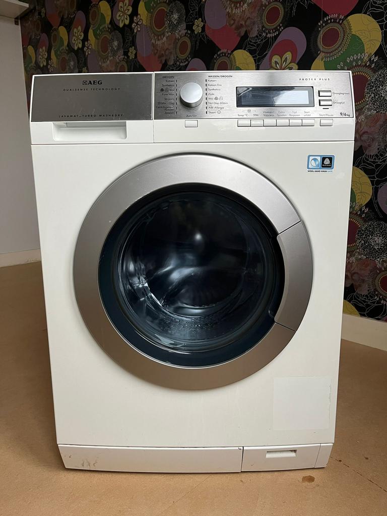 AEG Was-Droogcombinatie L87695NWD–9 kg wassen / 6 kg drogen, Ophalen, Zo goed als nieuw, 1200 tot 1600 toeren, 85 tot 90 cm