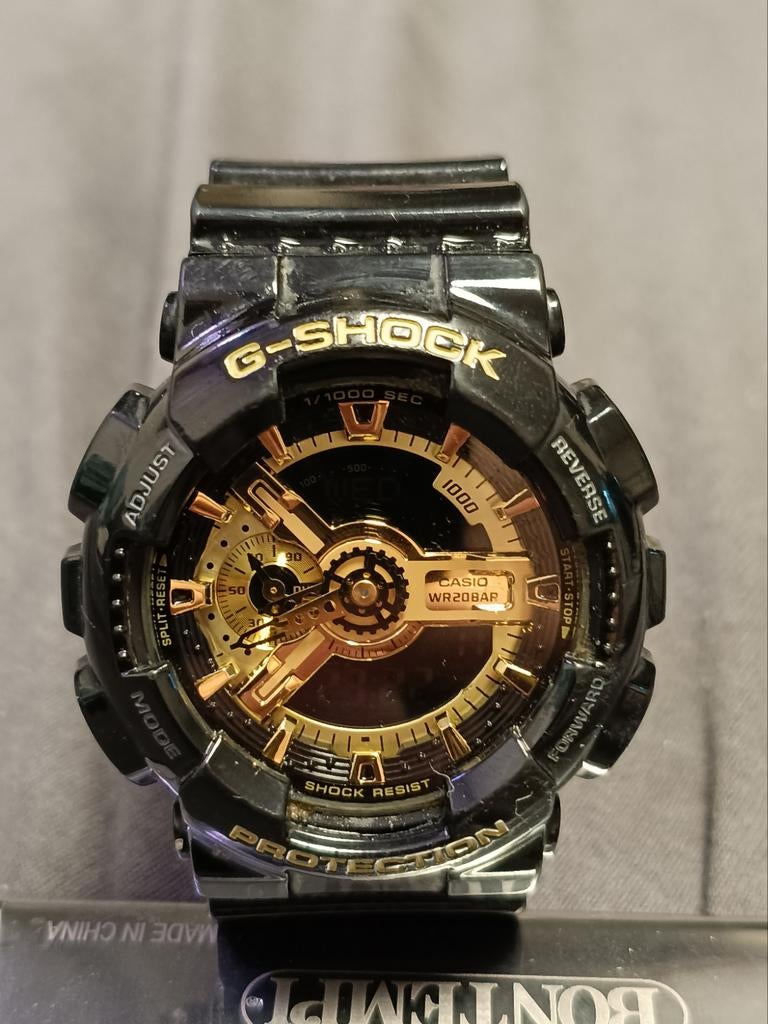 Goud/Zwarte Casio G-Shock GA-110GB-1A - Stoer Horloge!, Sieraden, Tassen en Uiterlijk, Horloges | Heren, Casio, Kunststof, Gebruikt