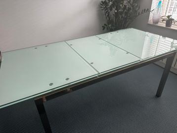 Uitschuifbare glazen eettafel rvs onderstel tafel  beschikbaar voor biedingen