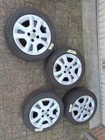 Set winterbanden compleet met doppen Opel karl  5.5 6.3 mm, Ophalen of Verzenden