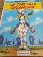 Lucky Luke De trek naar Oklahoma, Boeken, Eén stripboek, Ophalen of Verzenden, Zo goed als nieuw, Morris & Goscinny