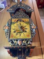 ouderwetse tinnen klok, Ophalen