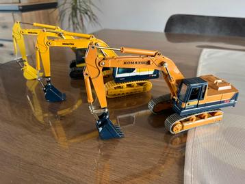 Trio historische Komatsu rupskranen PC 200 PC 210 beschikbaar voor biedingen
