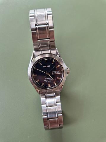 Seiko herenhorloge Sapphire-glas en Water resistant 100m 10B beschikbaar voor biedingen