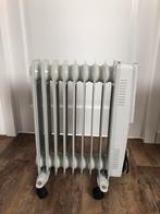 Oliegevulde radiatorkachel op wieltjes, Doe-het-zelf en Verbouw, 800 watt of meer, Minder dan 60 cm, Zo goed als nieuw, Radiator