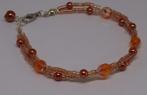 Armbandje met oranje pareltjes en facetkralen, Ophalen of Verzenden, Nieuw, Oranje, Overige materialen