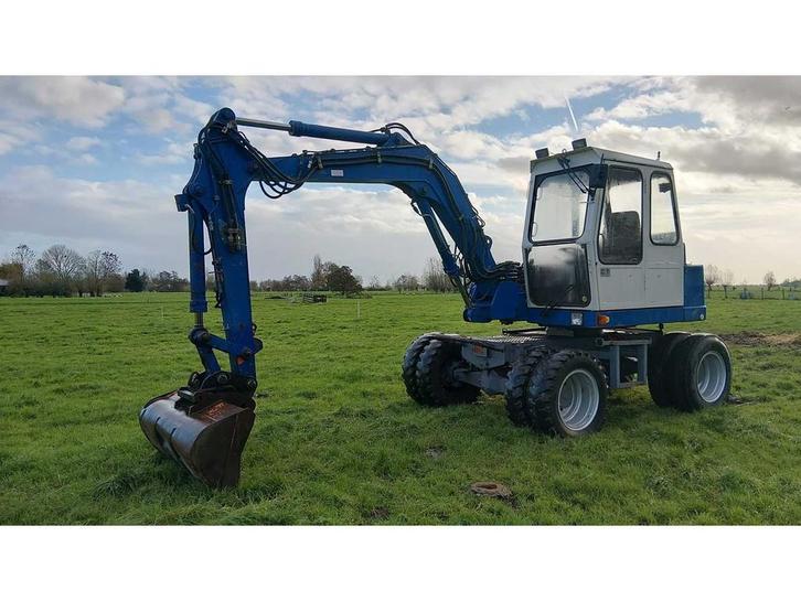 1989 Atlas 1004 Banden graafmachine, Zakelijke goederen, Machines en Bouw | Kranen en Graafmachines, Graafmachine