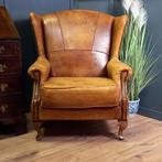 Karakteristieke vintage schapenleren oorfauteuil, Gebruikt, Ophalen of Verzenden, 75 tot 100 cm, Hout