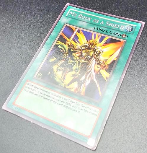 Yu-Gi-Oh! Kaart Magician's Force My Body As A Shield MFC-092, Hobby en Vrije tijd, Verzamelkaartspellen | Yu-gi-Oh!, Zo goed als nieuw