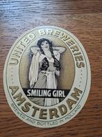 United breweries smiling gril bieretiket ongebruikt Amstel, Ophalen of Verzenden, Nieuw, Overige typen, Overige merken