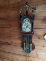 Friese Stoelklok met Atlas beeld, Ophalen