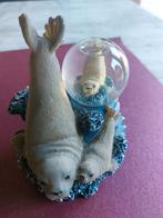 Leuke Sneeuw bal met zeehonden, Ophalen