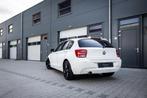 BMW 1-serie 116i Sport Automaat (136pk) 5-drs NAVI STOELVERW, Auto's, Gebruikt, 4 cilinders, Wit, 1285 kg