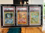 Pokémon PSA 7 1999 Charizard, Venusaur, Blastoise Set, Ophalen of Verzenden, Zo goed als nieuw, Meerdere kaarten, Foil