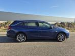 Opel Astra Sports Tourer 1.2 Business Elegance Dealer onderh, Auto's, Gebruikt, Euro 6, 1199 cc, Blauw