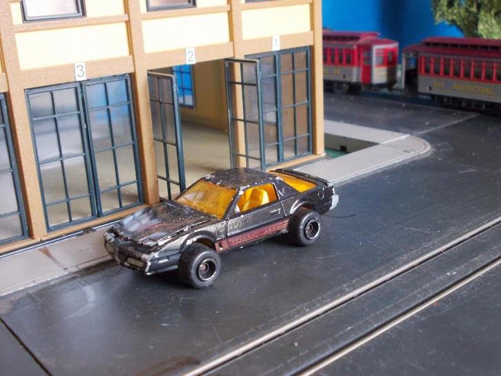 1:62 Pontiac Firebird Trans-Am Majorette brede wielen zwart, Hobby en Vrije tijd, Modelauto's | Overige schalen, Gebruikt, Auto