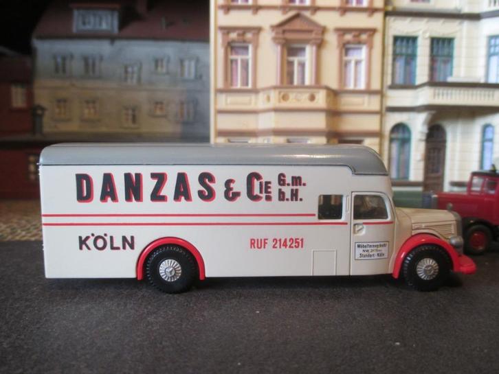 1951 Mercedes Benz O6600 - Brekina Danzas Meubeltransport, Hobby en Vrije tijd, Modelauto's | 1:87, Zo goed als nieuw, Ophalen of Verzenden