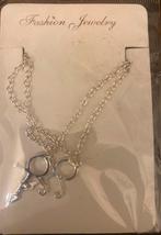 Prince symbool ketting 2 hangers., Ophalen, Nieuw, Zilver, Overige materialen