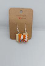 Tompouce oorbellen, Overige materialen, Hangers, Nieuw, Oranje