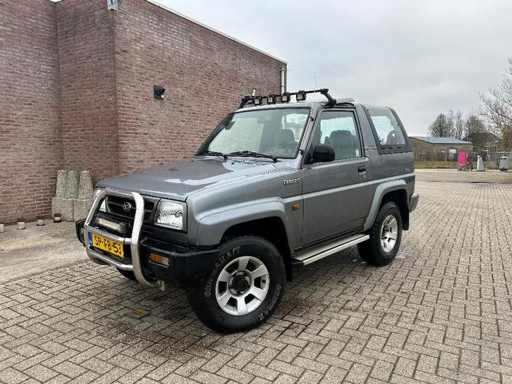 Daihatsu Feroza 1.6 Cabriotop 4WD 1997 Grijs, Auto's, Daihatsu, Bedrijf, Feroza, 4x4, Elektrische buitenspiegels, Elektrische ramen