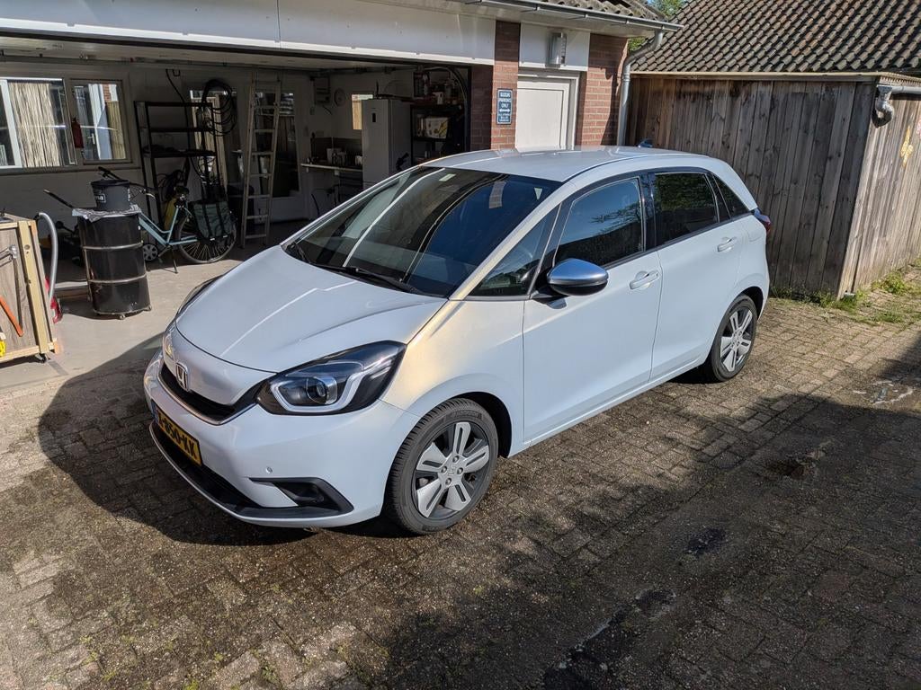 Honda Jazz 1.5 I-mmd 109pk Hybrid CVT 2020 Wit parelmoer, Auto's, 1498 cc, Leder en Stof, Wit, 98 pk