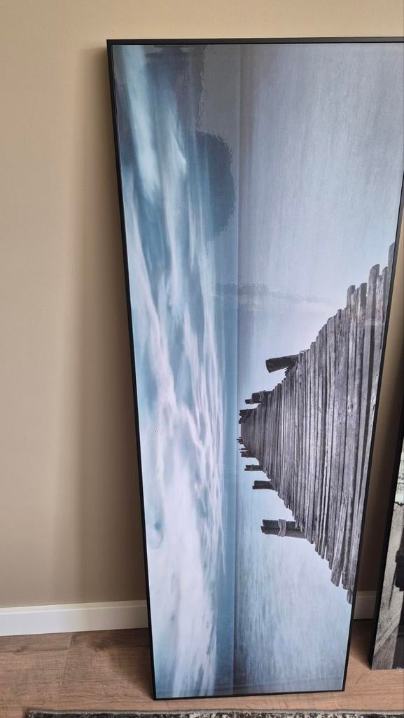 Groot schilderij met steiger aan zee, Ophalen
