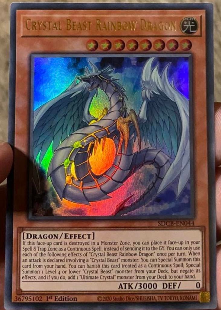 Yu-Gi-Oh! Crystal Beast Rainbow Dragon SDCB 1st Edition !, Ophalen of Verzenden, Zo goed als nieuw, Losse kaart, Foil